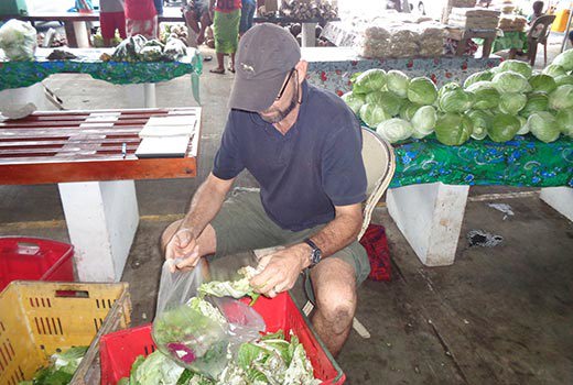 Professor Steven Underhill measuring food losses in Apia markets, Samoa