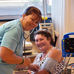 USC Nursing Science student Kelly Scott conducts health checks on Crystel Schuchmann in the USC Fraser Coast nursing labs.