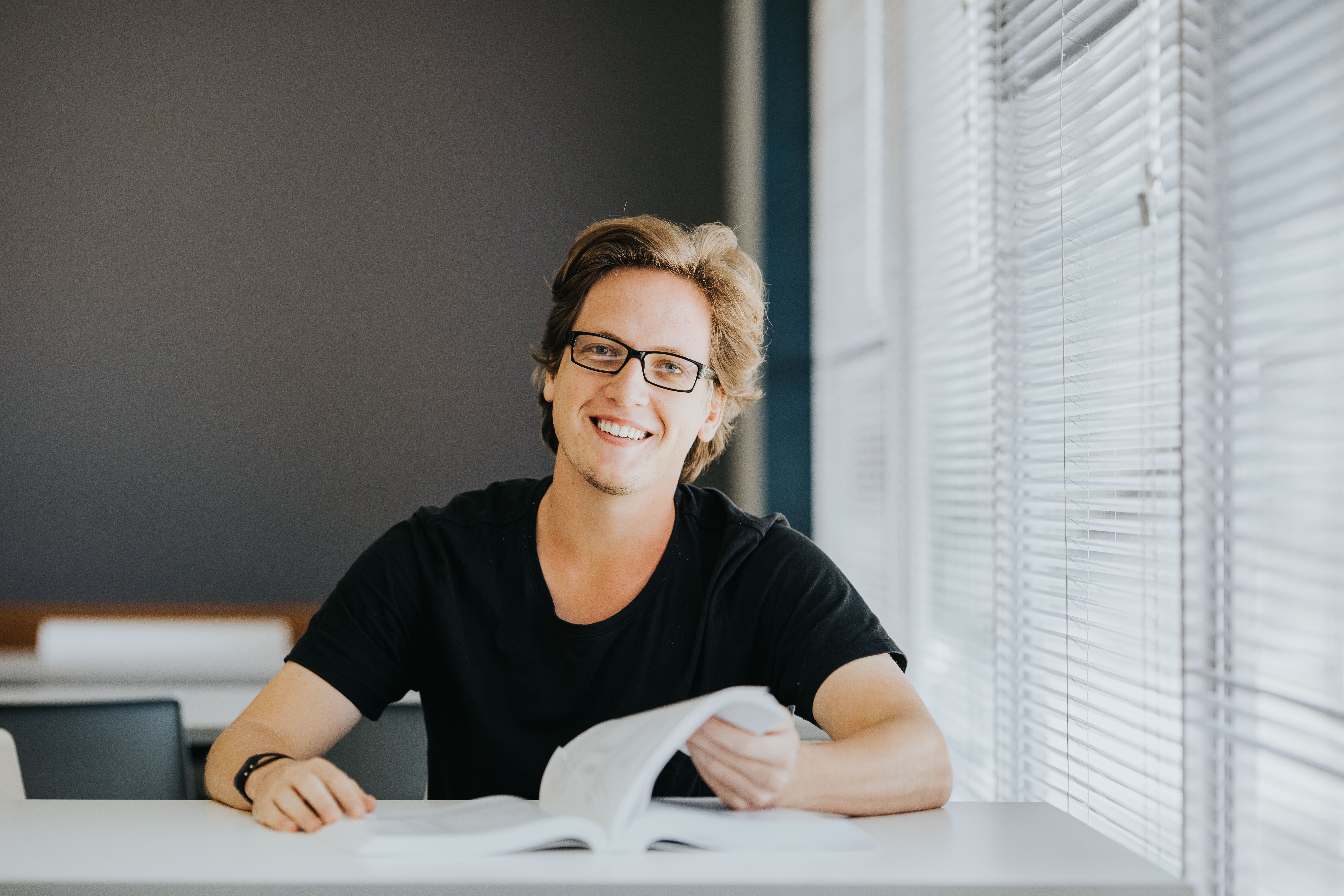 Male student studying at desk