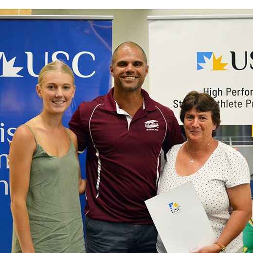 Brendan Powell presents Oztag scholarships to Tessa Campbell, left, and Rachael Harper's mother Lisa  Ney