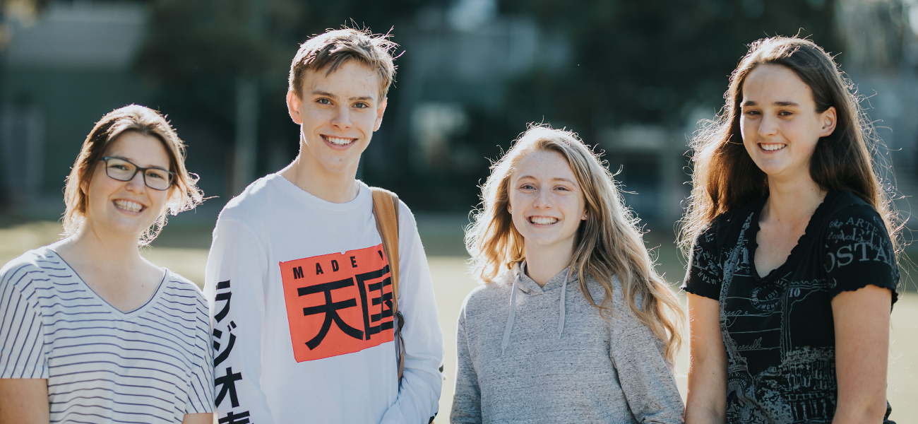 smiling students looking at camera