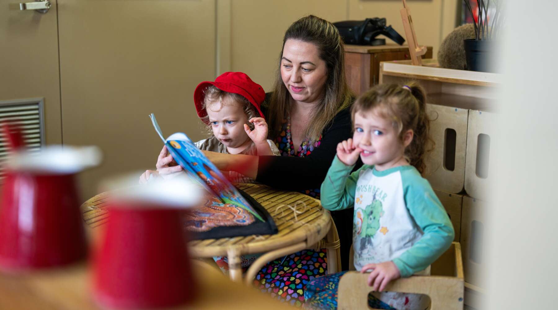 Kristin Papworth reading to her daughters