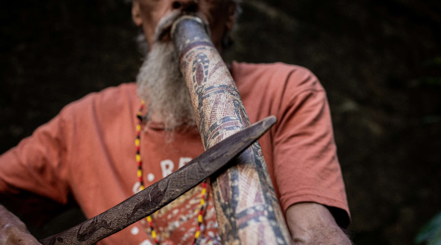 uncle kevin starkey playing the yidaki, also known as the didgeridoo