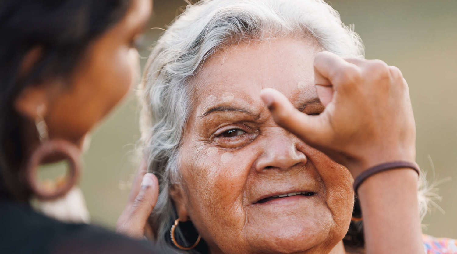 Indigenous women having her face painted