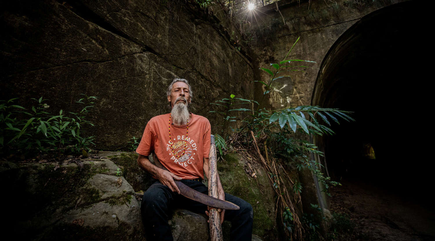 uncle kevin starkey leaning on a rock at buderim falls