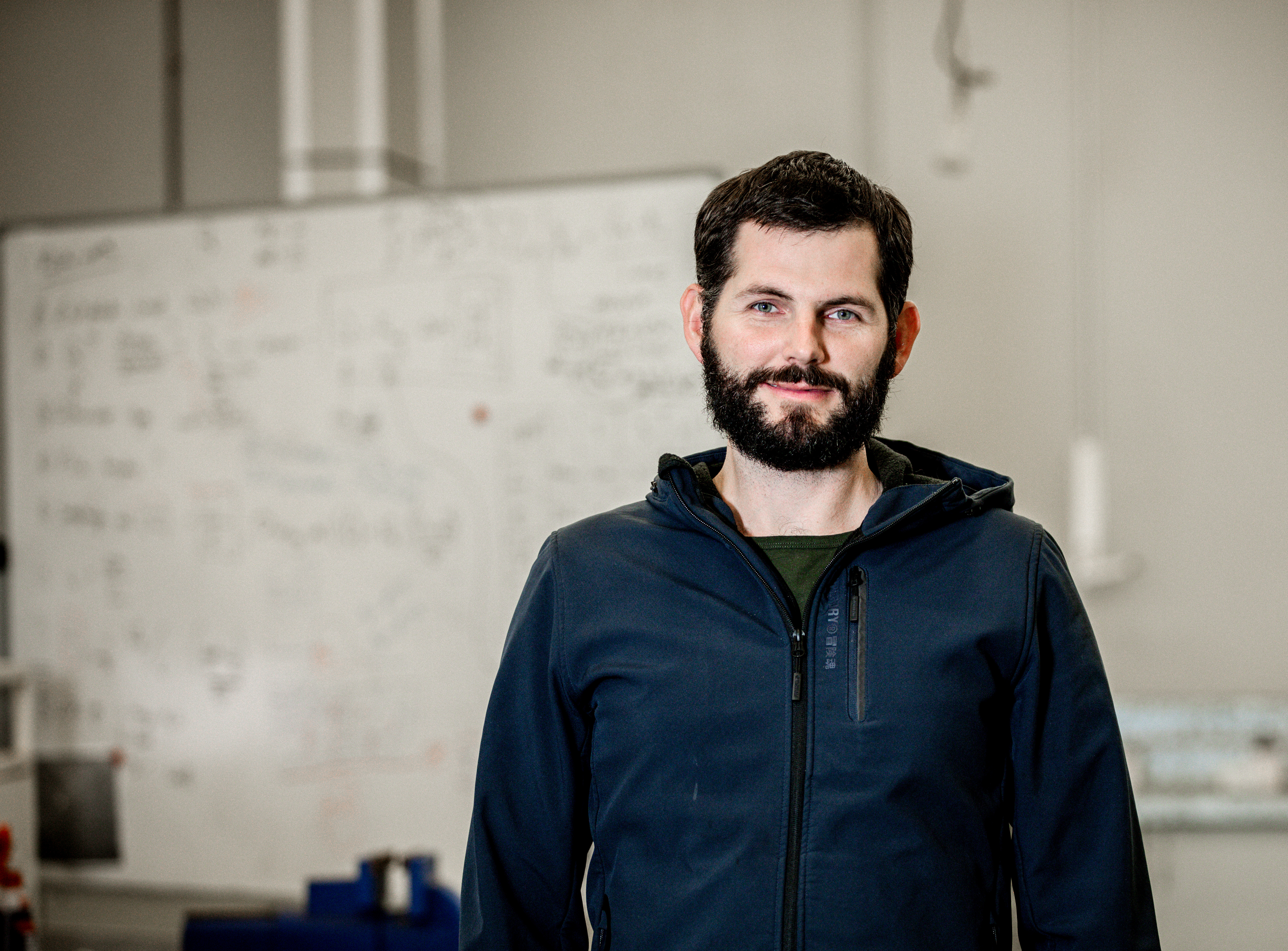 Blake, pictured in a UniSC engineering lab shirt