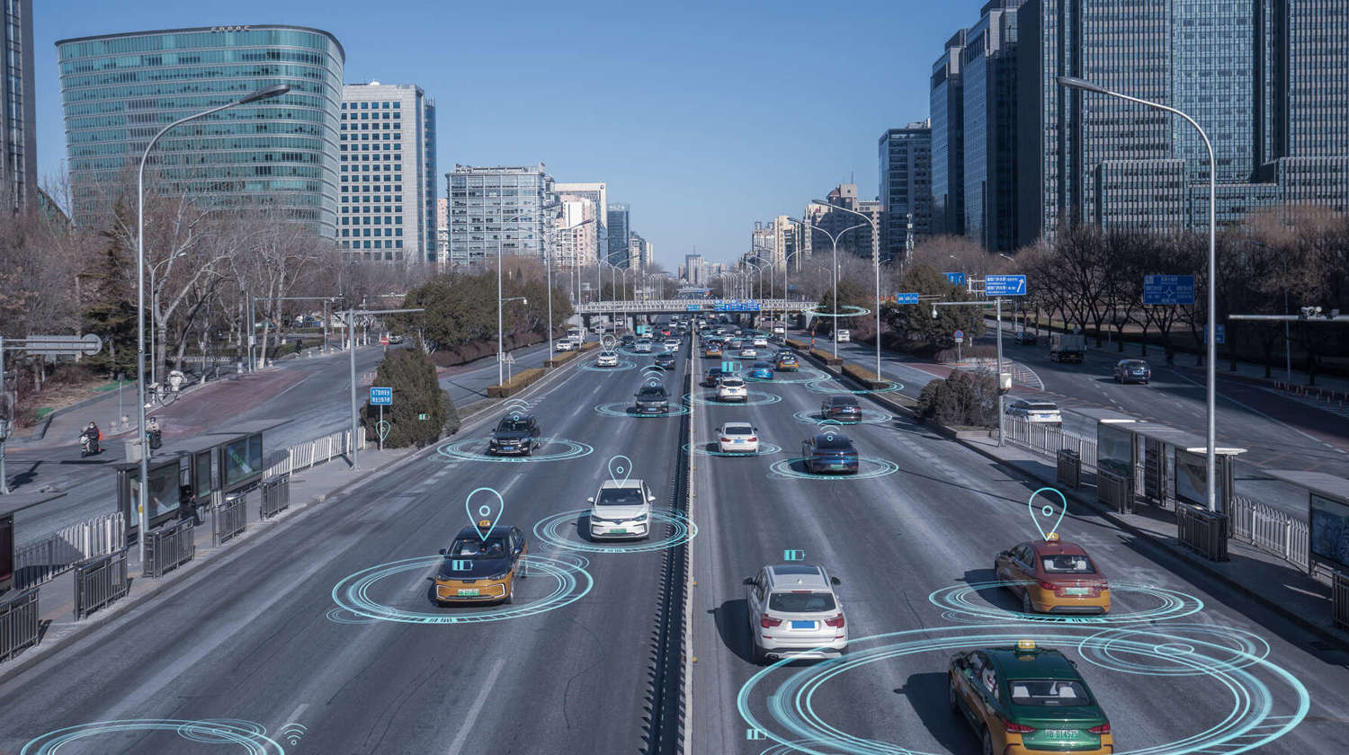 birds eye view of cars driving on highway transmitting data like location 