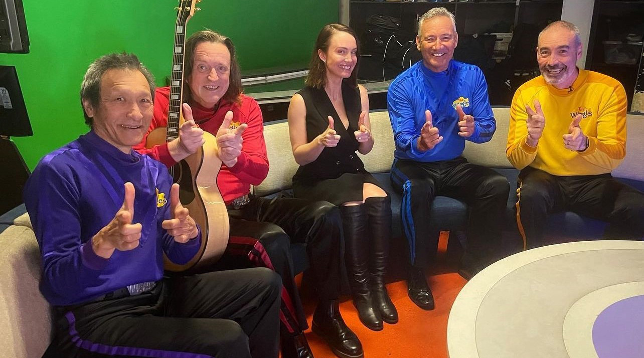 A colourful picture of the original Wiggles at Channel 7's Sunrise with Jeff Fatt, Murray Cook, Bec Brown, Anthony Field, Greg Page