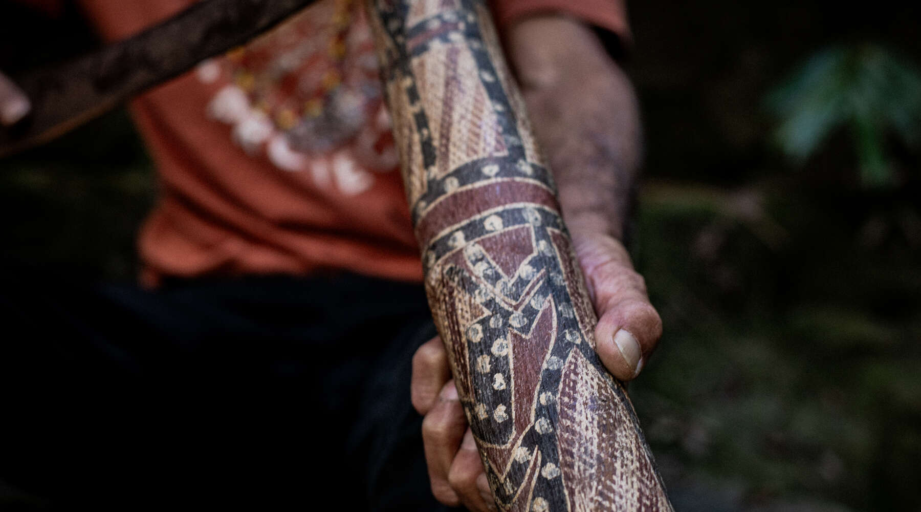 uncle kevin starkey playing the yidaki, also known as the didgeridoo